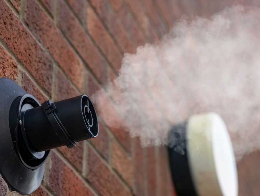 Plumbing and heating engineers working on a domestic system in London